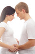 Young attractive couple: pregnant mother and happy father