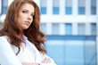 business woman on modern glass exterior