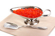 Red caviar in silver bowl isolated on white