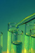 test-tubes with liquid on blue background