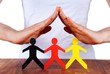 hands protecting colorful paper chain people