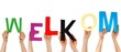 hands holding WELKOM
