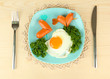 Sausages in form of hearts, scrambled eggs and parsley,