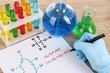 Hand scientist writing formulas