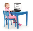 Little scholar in a school desk with laptop.