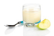 Delicious yogurt in glass with apple isolated on white