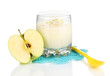 Delicious yogurt in glass with apple isolated on white