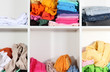 Clothing scattered on shelves