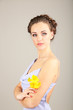 Young woman with beautiful hairstyle and flowers,
