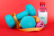 Dumbbells on red background