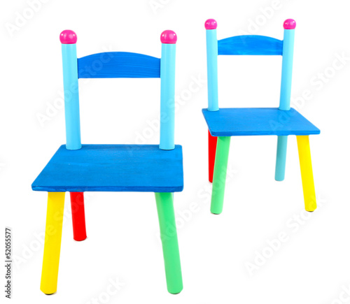 Photo: Small and colorful chairs for little kids isolated on white Small and colorful chairs for little kids isolated on white
