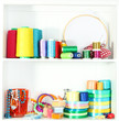 Beautiful white shelves with thread and material for