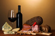 Exquisite still life of wine, cheese and meat products