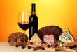 Exquisite still life of wine, cheese and meat products
