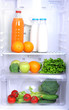 Open refrigerator with vegetarian food