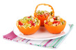 Fruit salad in hollowed-out orange isolated on white