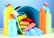 Cleaning items in bucket on  color background