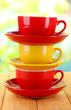Three cups on nature background