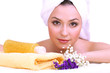Beautiful young woman with flowers and towel