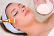 Beautiful young woman in cosmetic salon close up