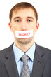 Young businessman with a band on his mouth isolated on white