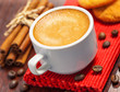 Coffee cup, cookies and cinnamon on a table