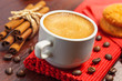 Coffee cup, cookies and cinnamon on a table