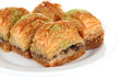 Sweet baklava on plate isolated on white