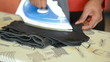 African american maid ironing washed up clothes