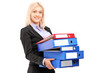 A young businesswoman carrying folders