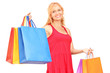 Photo: A mature woman posing with shopping bags A mature woman posing with shopping bags