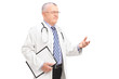 A male medical doctor in a uniform explaining