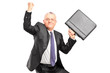 A happy mature businessperson with raised hands and briefcase