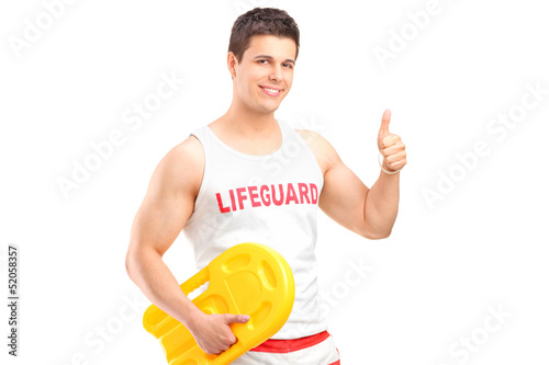 Photo: A happy lifeguard on duty giving a thumb up A happy lifeguard on duty giving a thumb up