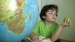 Video: Little boy concentrating on doing his homework Little boy concentrating on doing his homework