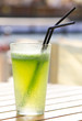 Glass of lemonade with green fresh mint in the sun