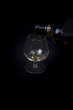 Pouring cognac into a Glass.