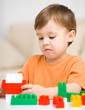 Foto: Boy is playing with building blocks Boy is playing with building blocks