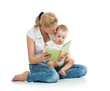 mother reading a book to her baby boy