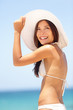Photo: Summer beach woman beautiful with sun hat Summer beach woman beautiful with sun hat