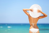 Woman enjoying beach relaxing in summer
