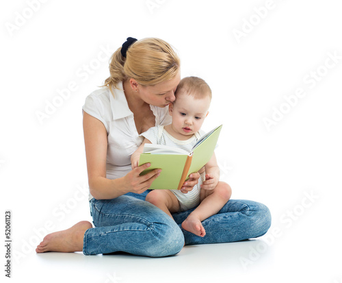 Photo: mother reading a book to her baby boy mother reading a book to her baby boy
