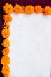 Frame of marigold on exotic dark red background
