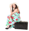 Photo: beautiful woman in summer dress with hat, case and money beautiful woman in summer dress with hat, case and money