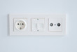 electrical, ethernet and tv or radio socket on the wall