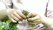 girl weaves a wreath of spring flowers