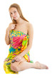 Photo: sexy young blonde woman wearing a bright pareo seats sexy young blonde woman wearing a bright pareo seats
