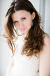 Portrait of beautiful young happy smiling woman with long curly