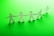 Paper people in teamworking concept