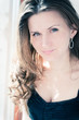 Portrait of beautiful young happy smiling woman with long curly
